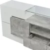 Close-up of a modern TV cabinet with white and gray finishes, featuring glass elements and open drawers. Náhled obrázku produktu