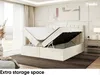 A bedroom scene with a bed frame open to reveal storage space, a nightstand, and a window with curtains. Produktbild-Vorschau