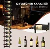 A wine rack with bottles of wine, glasses, and a gift box on a table, with additional wine bottles displayed below. Náhľad obrázku produktu
