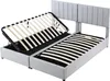 A light gray upholstered bed frame with a slatted base, with one section of the base lifted to reveal storage space underneath. The headboard is also visible. Produktbild-Vorschau