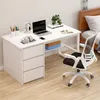 A white computer desk with a laptop, headphones, and office supplies, next to a bed. Produktbild-Vorschau