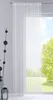 A white sheer curtain hangs in front of a window with a view of trees and sky. Produktbild-Vorschau