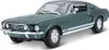 A dark green 1967 Ford Mustang Fastback model car is shown from a three-quarter front angle against a white background. Podgląd zdjęcia produktu