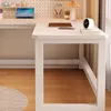 A white L-shaped computer desk with a pegboard wall and various desk accessories. Produktbild-Vorschau