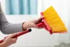 A person is assembling a broom. Produktbild-Vorschau