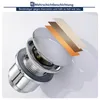 A close-up, angled view of a chrome faucet drain assembly with an illustration of its multi-layer coating. Náhled obrázku produktu