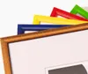 A close-up view of several colorful picture frames stacked diagonally on a white background. Produktbild-Vorschau