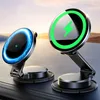 Two wireless charging stands with illuminated rings are displayed on a dark surface, with a blurred background of a sunset over a landscape. Podgląd zdjęcia produktu