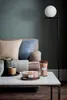 A cozy living room scene with a sofa, coffee table, and decorative items. Produktbild-Vorschau