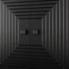 A close-up view of a black sideboard with a geometric, stepped design and two square handles. Voir les images du produit