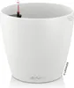 A white planter pot with a water level indicator. Voir les images du produit