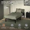 A metal bed frame with bedding is shown in a bedroom setting, with decorative elements and informational icons at the bottom. Produktbild-Vorschau