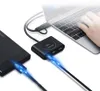 A laptop connected to a USB hub, which is also connected to an external hard drive. Náhľad obrázku produktu