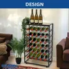 A metal wine rack filled with wine bottles, placed in a living room setting next to a sofa and a potted plant. Anteprima dell’immagine prodotto