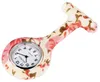 A floral patterned nurse's fob watch on a white background. Produktbild-Vorschau
