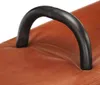 A close-up shot of a black handle on a brown leather surface. Voir les images du produit