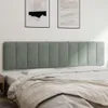 A headboard is shown mounted on a wall above a bed. Produktbild-Vorschau