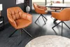 A dining room setting with several cognac-colored leather chairs around a table. Produktbild-Vorschau