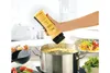 A hand is holding a yellow crepes-spätzle maker over a pot of boiling water. Produktbild-Vorschau