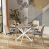 A dining table set in a modern dining room with artwork and plants. Náhľad obrázku produktu