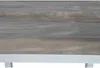 A close-up view of a table with a wood-like ceramic top and a white frame. Produktbild-Vorschau