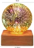 A decorative LED lamp with a 3D crystal ball effect on a wooden base. Produktbild-Vorschau