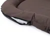A close-up view of a brown dog bed, showing the zipper and interior filling. Náhled obrázku produktu