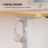 A close-up view of a desk with headphones hanging from a metal hook. Podgląd zdjęcia produktu