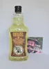 A bottle of Reuzel Daily Shampoo is placed next to a photograph of a man. Náhled obrázku produktu