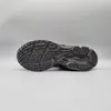 The sole of a black ASICS Gel-Kayano 14 sneaker is shown against a plain gray background. Produktbild-Vorschau