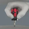 A hand wearing a white glove is holding a screwdriver. Produktbild-Vorschau