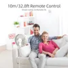 A couple relaxing on a couch with a fan in the foreground. Podgląd zdjęcia produktu