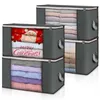 Four stacked storage boxes filled with folded clothes, with one box showing a Christmas theme. Produktbild-Vorschau