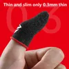 A close-up shot of a finger wearing a black gaming finger sleeve with a red trim and a white logo, against a red background with large, faint white numbers. Produktbild-Vorschau