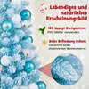 A close-up of a blue artificial Christmas tree decorated with white and light blue ornaments and cotton balls, with marketing text and graphics on the right side. Podgląd zdjęcia produktu