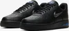 A pair of black Nike Air Force 1 sneakers with grey and blue accents. Produktbild-Vorschau