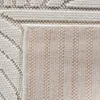 A close-up view of a rug, showing both the top textured surface and the underside. Voir les images du produit