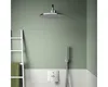 A modern bathroom with a shower fixture and a ladder with a towel. Produktbild-Vorschau