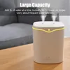A beige humidifier with a yellow light strip is on a wooden table, with a grey sofa in the background. Náhľad obrázku produktu