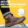 A person wearing a brown work boot with sharp metal spikes protruding from the sole, set against a yellow background. Produktbild-Vorschau