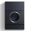 A modern, dark gray mailbox with a circular silver frame around the mail slot. Produktbild-Vorschau