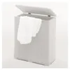 A white laundry basket with a white towel draped over the edge, with the lid open. Podgląd zdjęcia produktu