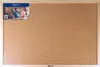A man is relaxing at his desk with a corkboard in the background. Náhľad obrázku produktu