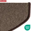 A close-up view of a brown carpeted stair mat with a dark brown edge binding. The mat has a textured surface. A logo and certification mark are visible in the corners. Produktbild-Vorschau