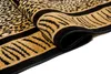 A close-up view of a rolled-up rug with a leopard and tiger print pattern. Produktbild-Vorschau