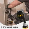 A person is using a tile laying vibrator tool on a wall. Podgląd zdjęcia produktu