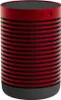 A red and black cylindrical speaker with a black base. Náhled obrázku produktu