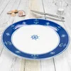 A single dinner plate with a nautical theme is placed on a wooden table. Podgląd zdjęcia produktu