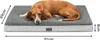 A dog lying on a dog bed with dimensions indicated. Produktbild-Vorschau