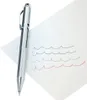 A silver multi-color pen is shown on a white surface with wavy lines drawn in blue, green, and red. Podgląd zdjęcia produktu